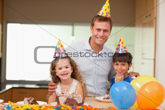 Father celebrating birthday with his kids