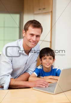 Father and son with notebook