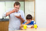 Father and son having cereals