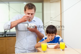 Father and son having cereals