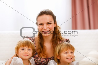 Portrait of mother with twins daughters