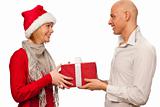 Christmas gift - Girl in santa dress giving a gift to a man
