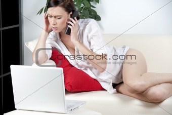 Woman in casual wear expressing concern on the phone