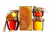 Jars of honey and dipper