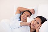 Man waking his girlfriend with snoring