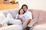 Couple enjoys watching television together