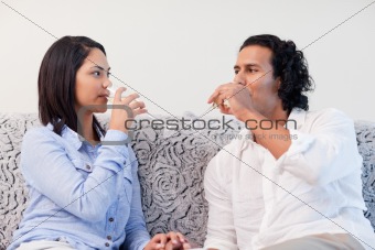 Couple drinking sparkling wine in the living room