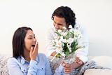 Woman getting flowers from her boyfriend