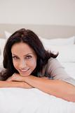 Smiling woman on the bed