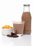 Chocolate milk and cornflakes over white background
