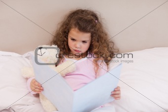 Girl looking at a book