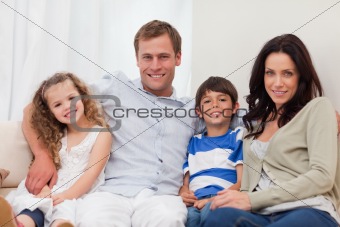Family sitting on the sofa together