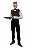 A young boy waiter with a tray