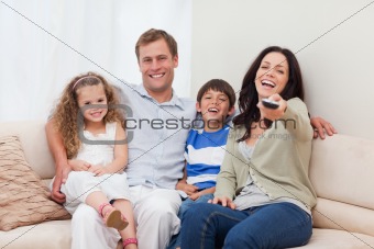 Family watching comedy together