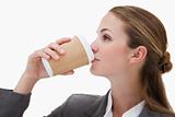 Businesswoman drinking a takeaway coffee