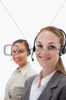 Portrait of young operators using headsets