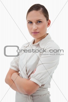 Portrait of a young businesswoman with the arms crossed