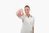 Female real estate agent holding keys
