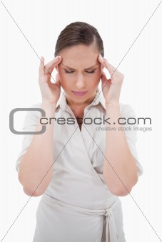 Portrait of a businesswoman having a headache