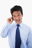 Portrait of a surprised businessman making a phone call