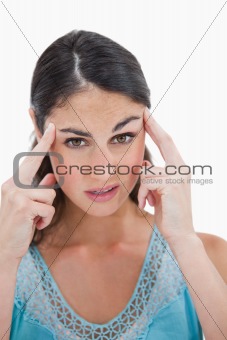 Portrait of a beautiful woman having a headache
