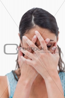 Portrait of a woman hiding her face