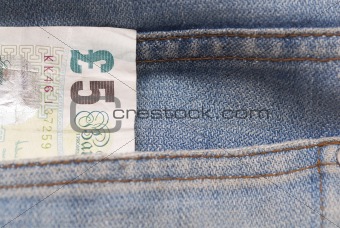 Five Pound Note in Jeans Pocket.