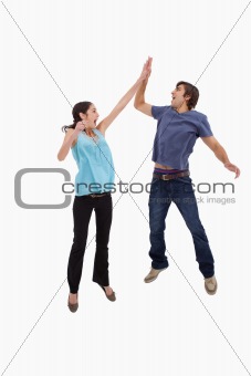 Portrait of a couple jumping together
