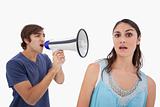 Man yelling at her girlfriend through a megaphone