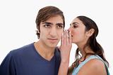 Woman whispering something to her fiance