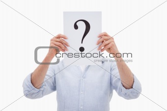 Portrait of a man hiding his face behind a question mark