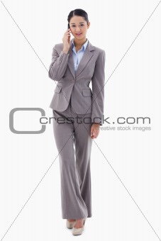 Portrait of a young businesswoman making a phone call