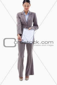 Portrait of a businesswoman showing a contract