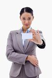 Portrait of a businesswoman showing a blank business card