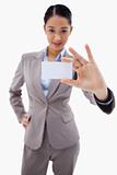 Portrait of a young businesswoman showing a blank business card
