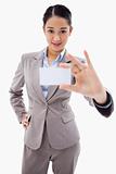 Portrait of a gorgeous businesswoman showing a blank business card