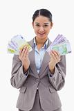 Portrait of a happy businesswoman holding bank notes