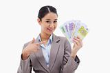 Smiling businesswoman holding bank notes