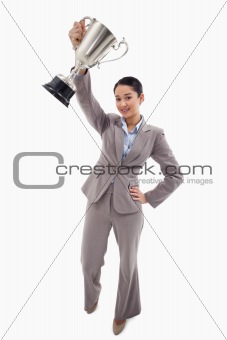 Portrait of a businesswoman showing a cup