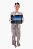 Portrait of a businesswoman showing a tablet computer