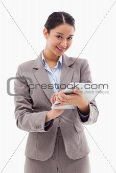 Portrait of a smiling businesswoman using a tablet computer