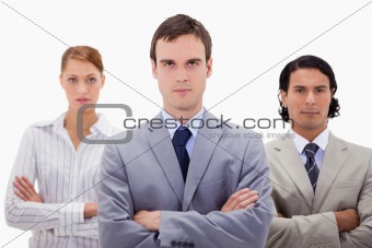 Confident businesspeople with arms folded