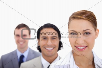 Smiling businessteam standing in line