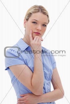 Thinking woman standing