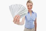 Money being held by smiling woman