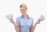 Smiling woman holding money in her hands