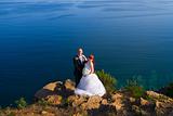 Bride and groom near the sea