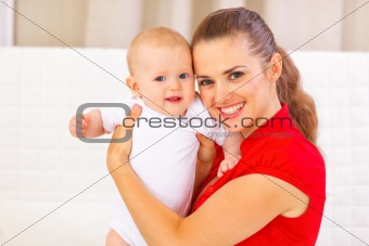 Portrait of adorable baby and young mother