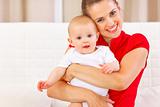 Portrait of cute baby and happy young mother