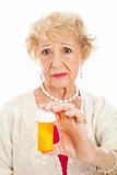 Sad Senior Woman with Pills